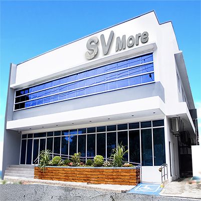 SV More building with blue glass windows and white facade.