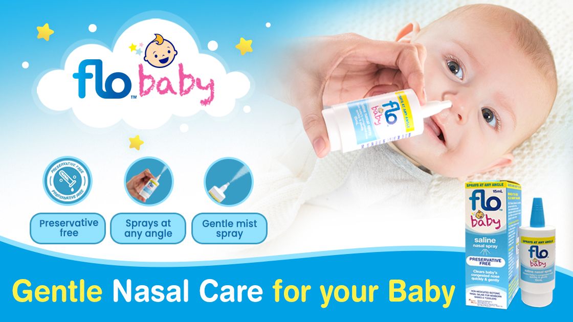 Cute baby, a hand seen, holding a nasal spray bottle, gently spraying on baby's left nostril. Clouds with product text, how-to-guide and product seen on lower right part of the image.