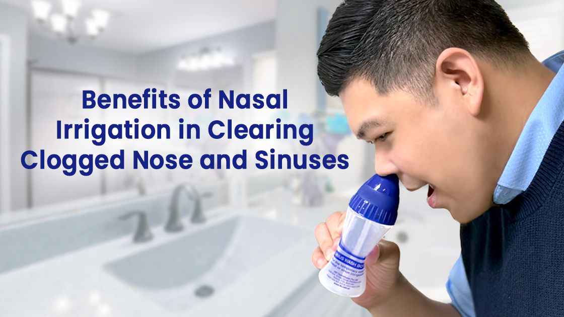 Man wearing blue cashmere, washing nasal sinuses, in the bathroom. Holding cleansing bottle.